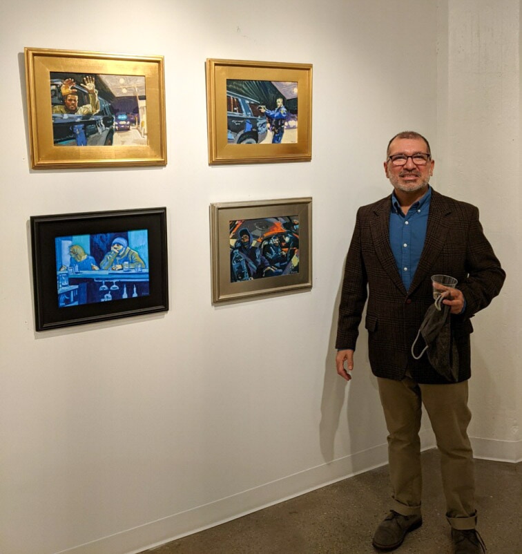 Francisco Silva in front of his paintings at Salon des Refuses in Jersey City