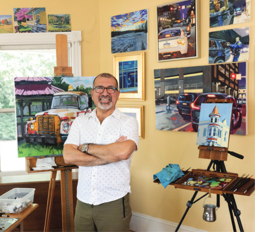 Francisco Silva with his paintings in his Frenchtown studio 