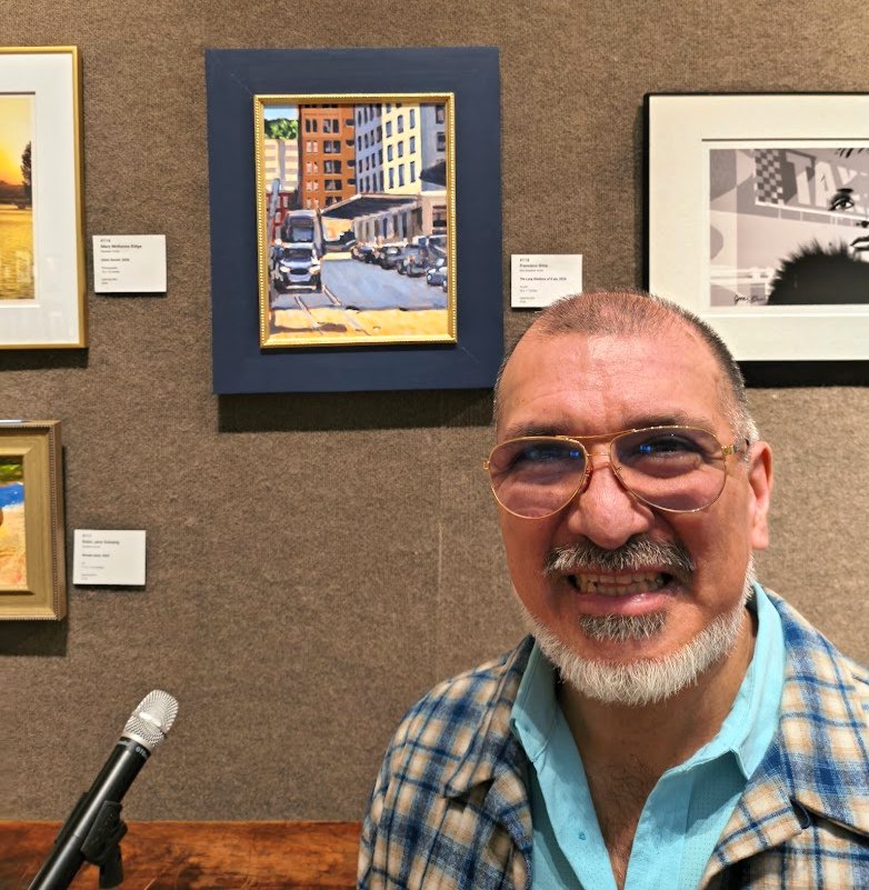 Francisco Silva at SCNY in front of his painting "The Long Shadows of 8am"